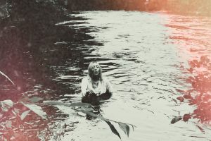 Reverend Kristin Michael Hayter announces her debut record, SAVED!, out on October 20th via Perpetual Flame Ministries