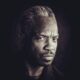 Eugene S. Robinson announces debut solo record, Eugene Sings!, out in 2026 via Ako-Lite Records